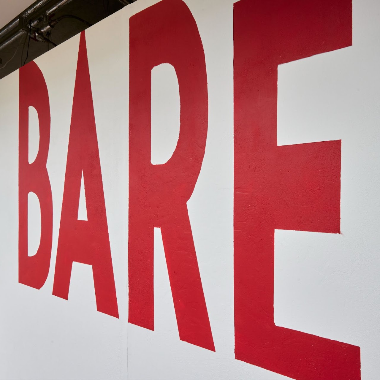 exhibition title wall for bare (2023), where ‘and she gave me magic’ by hazyn forsythe was displayed.